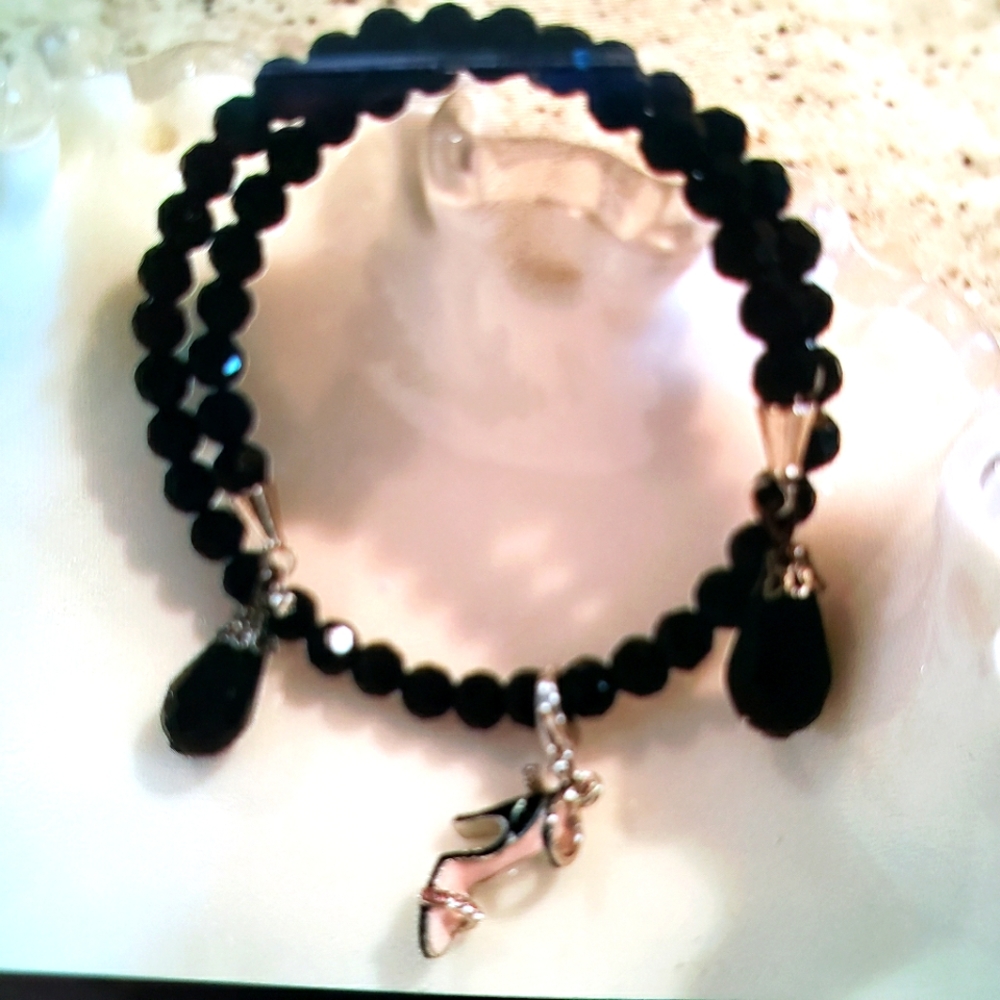 Bracelet.  Black jet crystal bracelet with high-heel pink and silver shoe.